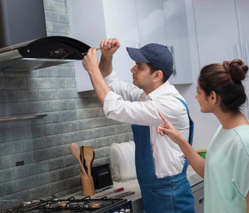 Verified kitchen repair technician servicing chimney Verified kitchen repair technician servicing chimney